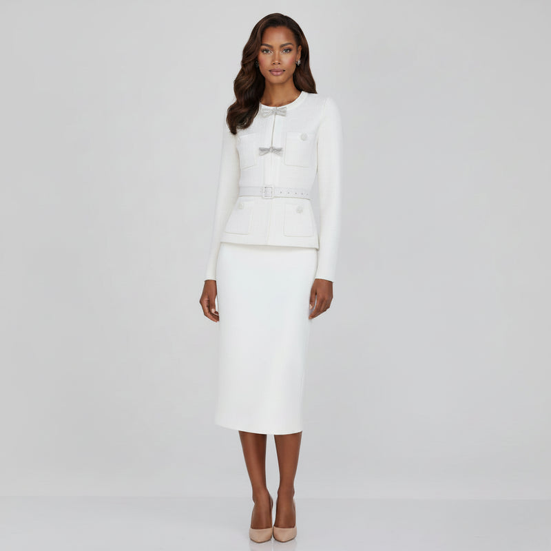 Woman wearing a white outfit with a belt on a white background