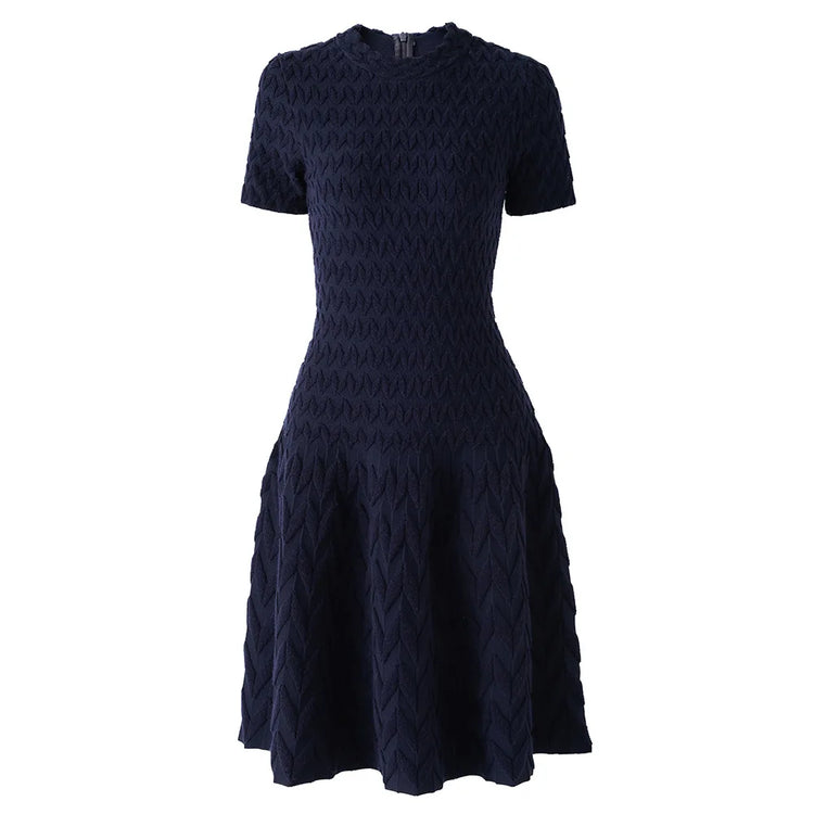 Navy blue patterned dress on a white background