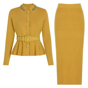 Mustard yellow jacket and skirt set with decorative buttons on a white background